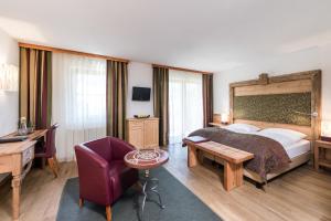 Televízia a/alebo spoločenská miestnosť v ubytovaní Sporthotel Exclusive