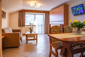 TV a/nebo společenská místnost v ubytování Hotel Pension Residence