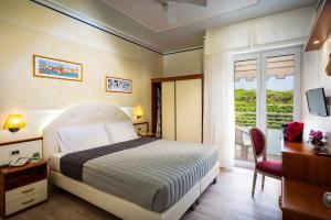 Postel nebo postele na pokoji v ubytování Hotel Danieli + 35 fotografií