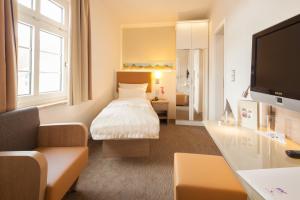 TV a/nebo společenská místnost v ubytování Hotel Erholung