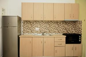 Kuchyň nebo kuchyňský kout v ubytování Anna Pousi Studios & Apartment