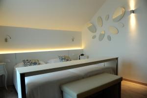 Postel nebo postele na pokoji v ubytování Hotel Bauer & Sporting