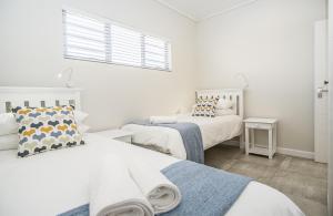 Ένα ή περισσότερα κρεβάτια σε δωμάτιο στο Fork West Holiday Apartments
