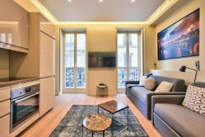 a living room with a couch and a table at 61- Big Luxury Parisian Flat 2DD in Paris