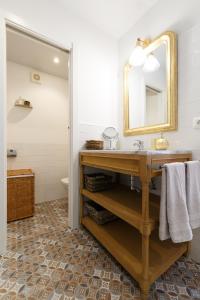 a bathroom with a sink and a mirror at Marbella Old Town House in Marbella