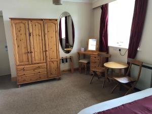 Voodi või voodid majutusasutuse Port Askaig Hotel toas