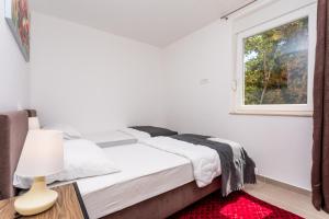 Ein Bett oder Betten in einem Zimmer der Unterkunft Villa Neda