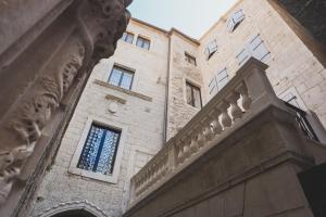 a building with a window on the side of it at Heritage Hotel Cardo in Split