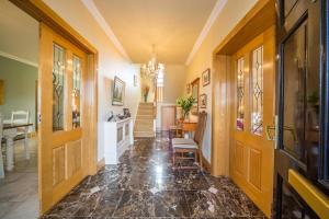 a hallway with a chandelier and a dining room at Knightsbrook Guesthouse in Trim