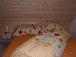 Rúm í herbergi á Ferienwohnung Brülisauer