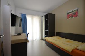 Katil atau katil-katil dalam bilik di Albergo Elvezia