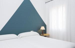 Postel nebo postele na pokoji v ubytování Apartments Mar de Tossa