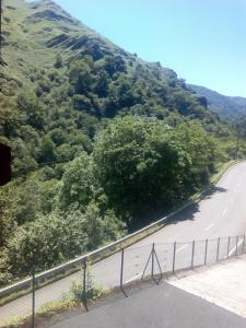 a mountain road with a fence on the side at Casa Manuelena in Valcarlos