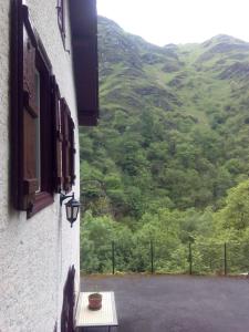 a window with a table and a view of a mountain at Casa Manuelena in Valcarlos