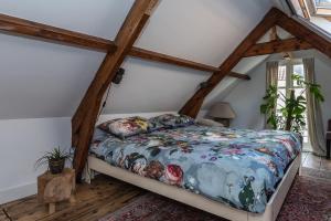 Ein Bett oder Betten in einem Zimmer der Unterkunft De zeeuwse Suites