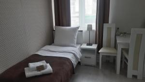 Posteľ alebo postele v izbe v ubytovaní Cracow Central Aparthotel