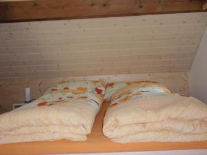 Rúm í herbergi á Ferienwohnung Brülisauer