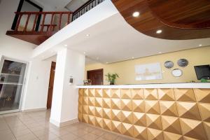 a lobby with a bar in a house at Hotel Real Bella Vista in Santo Domingo