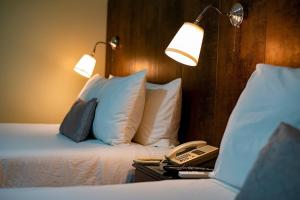 Ein Bett oder Betten in einem Zimmer der Unterkunft Hotel Real Bella Vista