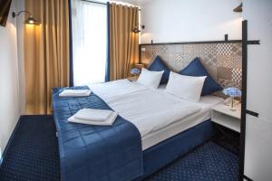 Кровать или кровати в номере Апарт-отель Наумов