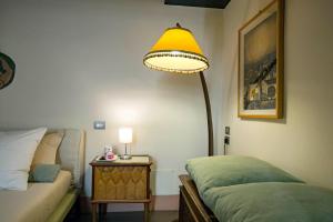 A bed or beds in a room at Starhost - DIMORA COPETA stunning seaview