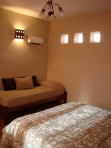 En eller flere senge i et værelse på Rinconcito en Tilcara