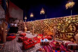 a living room filled with furniture and decorations at Riad Jemaa El Fna & Spa in Marrakesh