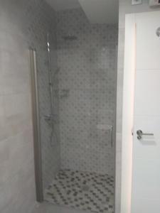 a bathroom with a shower with a glass door at Cerro del Alcazar in Baeza +23 photos