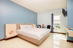 Postel nebo postele na pokoji v ubytování Je T'aime Hotel