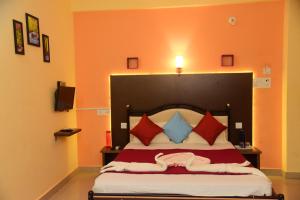 Un ou plusieurs lits dans un hébergement de l'établissement Bliss Holiday Inn Goa