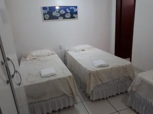 Postel nebo postele na pokoji v ubytování Grand Prix Hotel