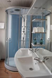a bathroom with a sink and a shower at Chalet Saint Bernard in Montgenèvre