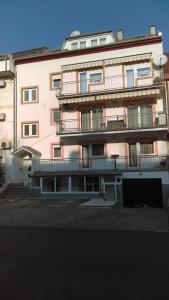 a large building with balconies on the side of it at Studio Apartment David in Zagreb