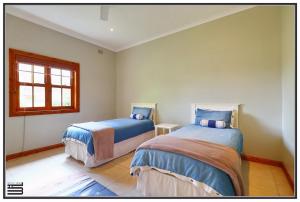 Katil atau katil-katil dalam bilik di Peace Cottage
