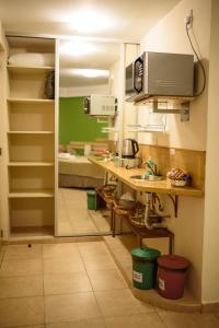 a kitchen with a counter and a sink in a room at AVEMAR Apart Hotel in Posadas