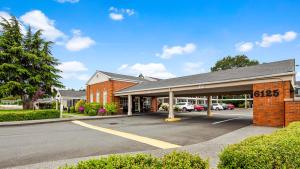 an empty parking lot in front of a building at Best Western Lakewood in Lakewood