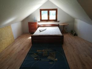 Łóżko lub łóżka w pokoju w obiekcie Siedlisko Matiaszówka