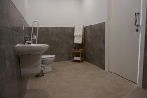 a bathroom with a sink and a toilet at Apartamentos nueva 13 in Ronda +51 photos