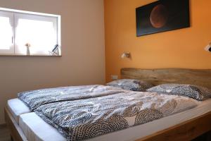 Postel nebo postele na pokoji v ubytování Zur Frankenhöhe