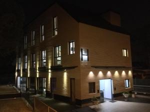 an exterior view of a building at night at H La Cabaña in Pozuelo de Alarcón