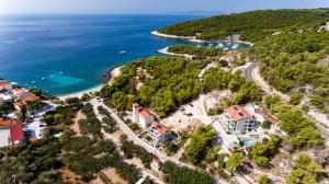 an aerial view of a village on the shore of a body of water at Luxurious Apartments Maslina with Beach in Milna