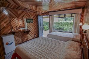Voodi või voodid majutusasutuse Hotel Don Taco toas