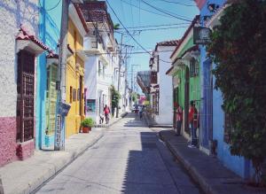 an empty street in a city with colorful buildings at Casa Anita in Cartagena de Indias