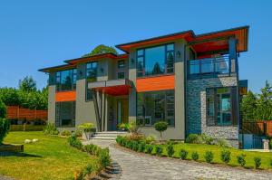 a house with a pathway in front of it at The Chateau in Burnaby