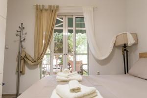 Posteľ alebo postele v izbe v ubytovaní Comfy Kourouta Apartment & Suite