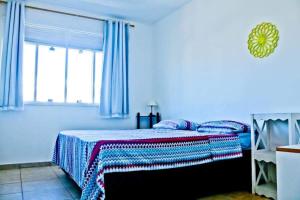 Ένα ή περισσότερα κρεβάτια σε δωμάτιο στο Casa Bossa Nova Guesthouse