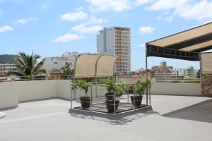 a group of potted plants on top of a roof at Departamento zona dorada in Mazatlán