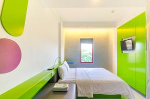 Cama o camas de una habitación en POP! Hotel Denpasar