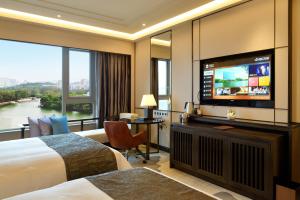 TV a/nebo společenská místnost v ubytování Fuzhou Lakeside Hotel