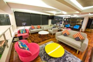 an overhead view of a living room with couches and chairs at Riverside Boutique Hotel in Kuantan